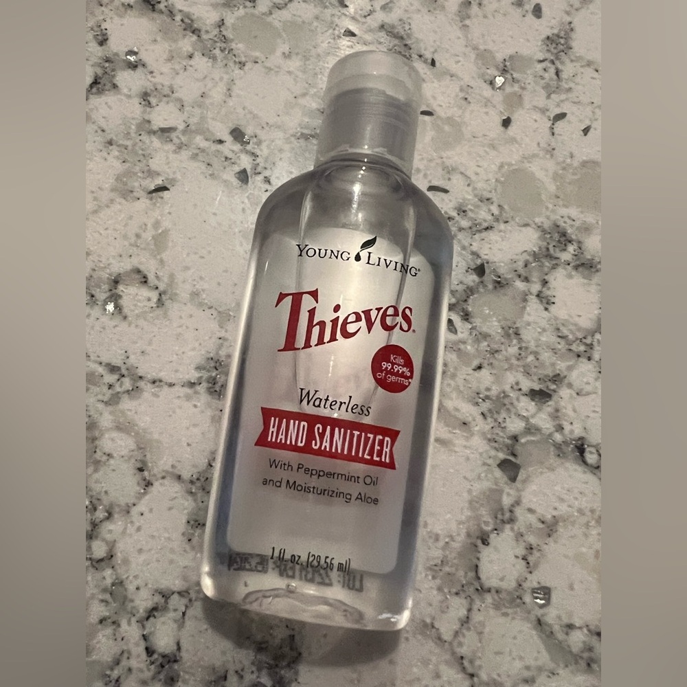 Young Living Thieves Waterless Hand Sanitizer With Gray Raccoon Holder - Picture 3 of 4
